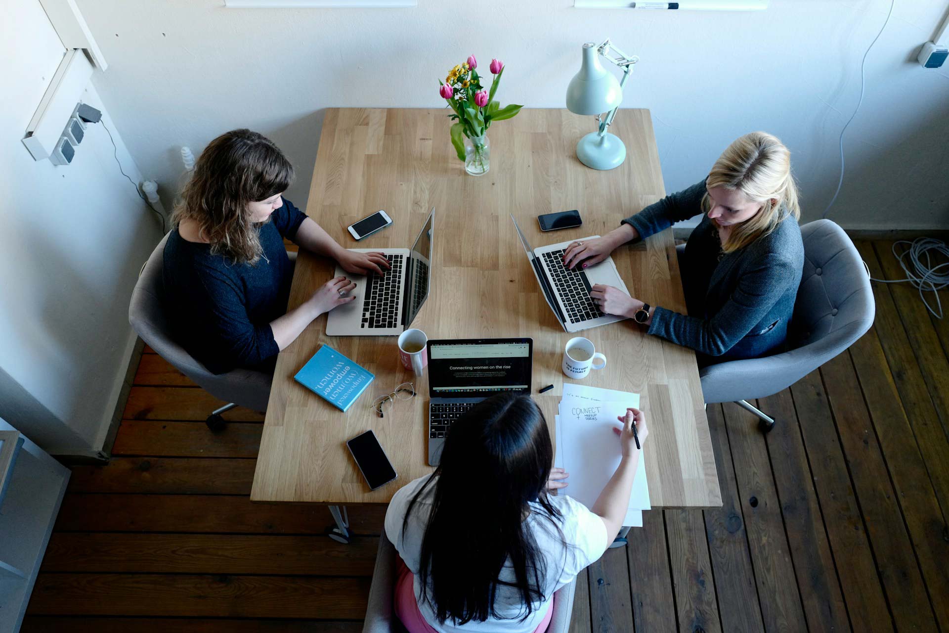 Three women at a formal consultation